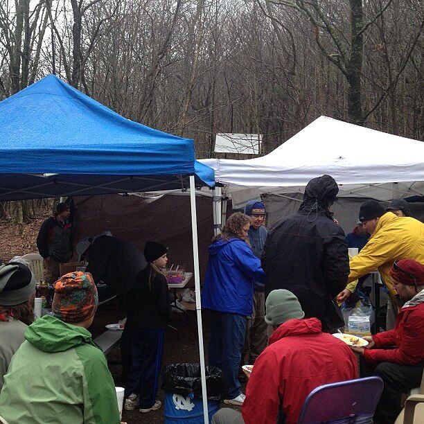 2013 – An Easter I Will Not Forget

The AT called, and I answered. During my trek, I woke early to another cold, rainy, nasty morning and hit the trail. What felt like a few hours later, I approached a parking area. You couldn’t miss the commotion—laughter, conversation, and the smell of amazing food hit you before you even saw the group. Pictured is the crowd gathered under awnings at a parking area.

As I walked past, someone came up to me and said, “Come get some breakfast!” This would go on to be one of the biggest trail angel experiences I had during my trip.

What you can’t see in the photo is the incredible spread of food.

This group has been coming together every Easter for 22 years to cook a magnificent breakfast for AT hikers. A six-egg omelet made to order, bacon, sausage, and of course, OJ—an incredible reprieve from the weather and the previous week of slogging along the cold trail. Spirits were lifted, laughter echoed under the awnings, and it was hard to leave and continue on that day.

Hard to believe that chapter of life was 12 years ago. IYKYK—and if not, grab a spot around a campfire sometime and I’ll tell you all about that past life chapter.